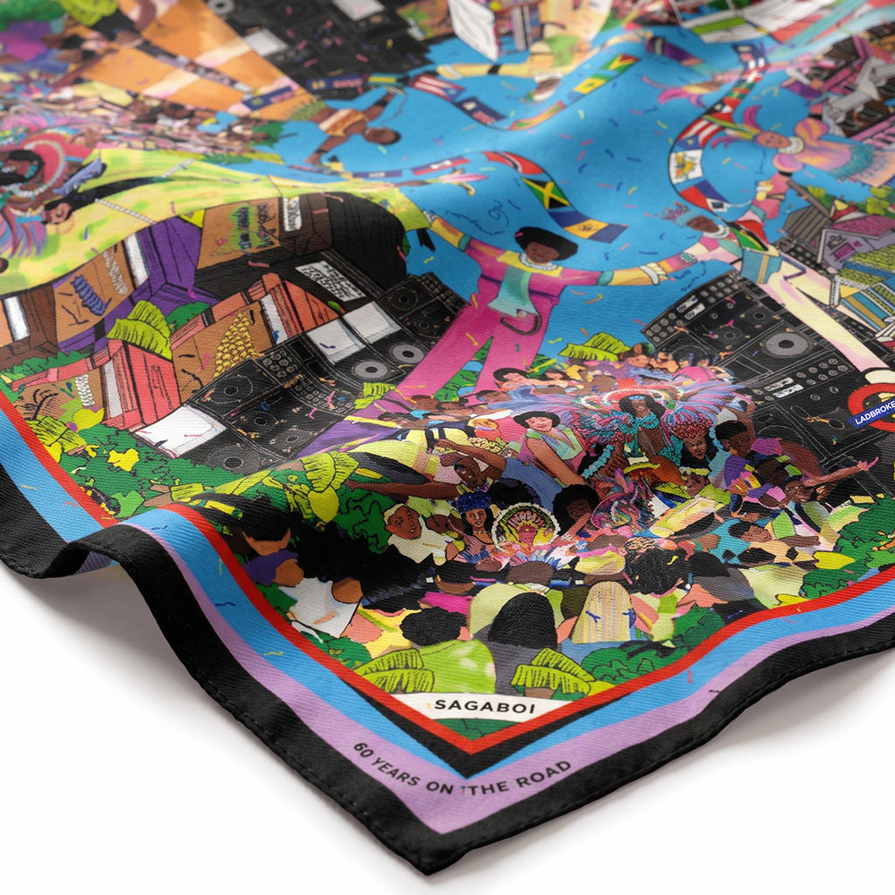 Detail of the Sagaboi 60 Years on the Road silk scarf showing the Carnival artwork and hand-rolled hem.
